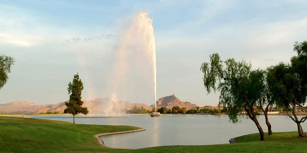 The fountain at Fountain Hills, Arizona, with Red Mountain in Mesa rising on the skyline behind it